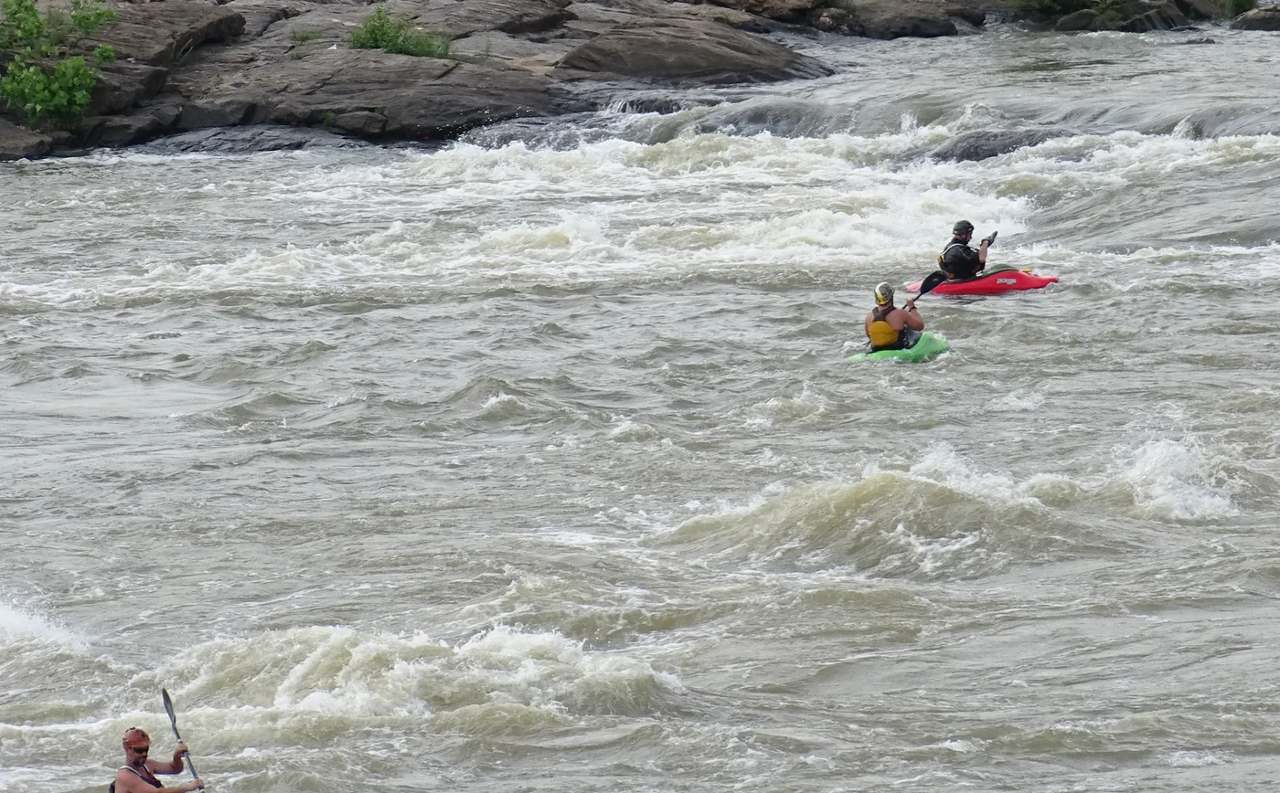 Kayakers in the whitewater of the Chattahoochee River in Columbus.
