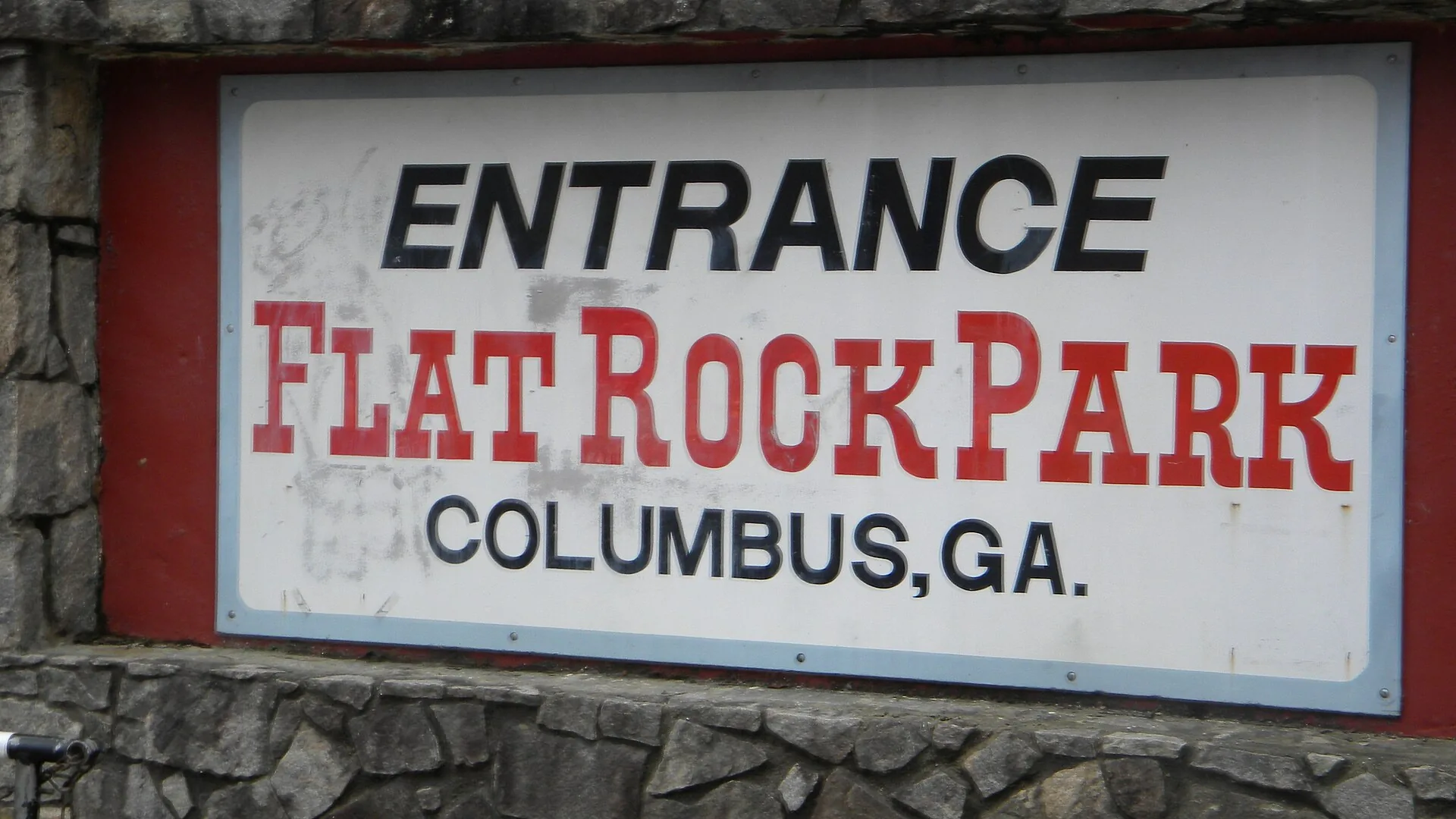 The entrance sign at Flat Rock Park, 6106 Warm Springs Road, in the Midland area of Columbus.