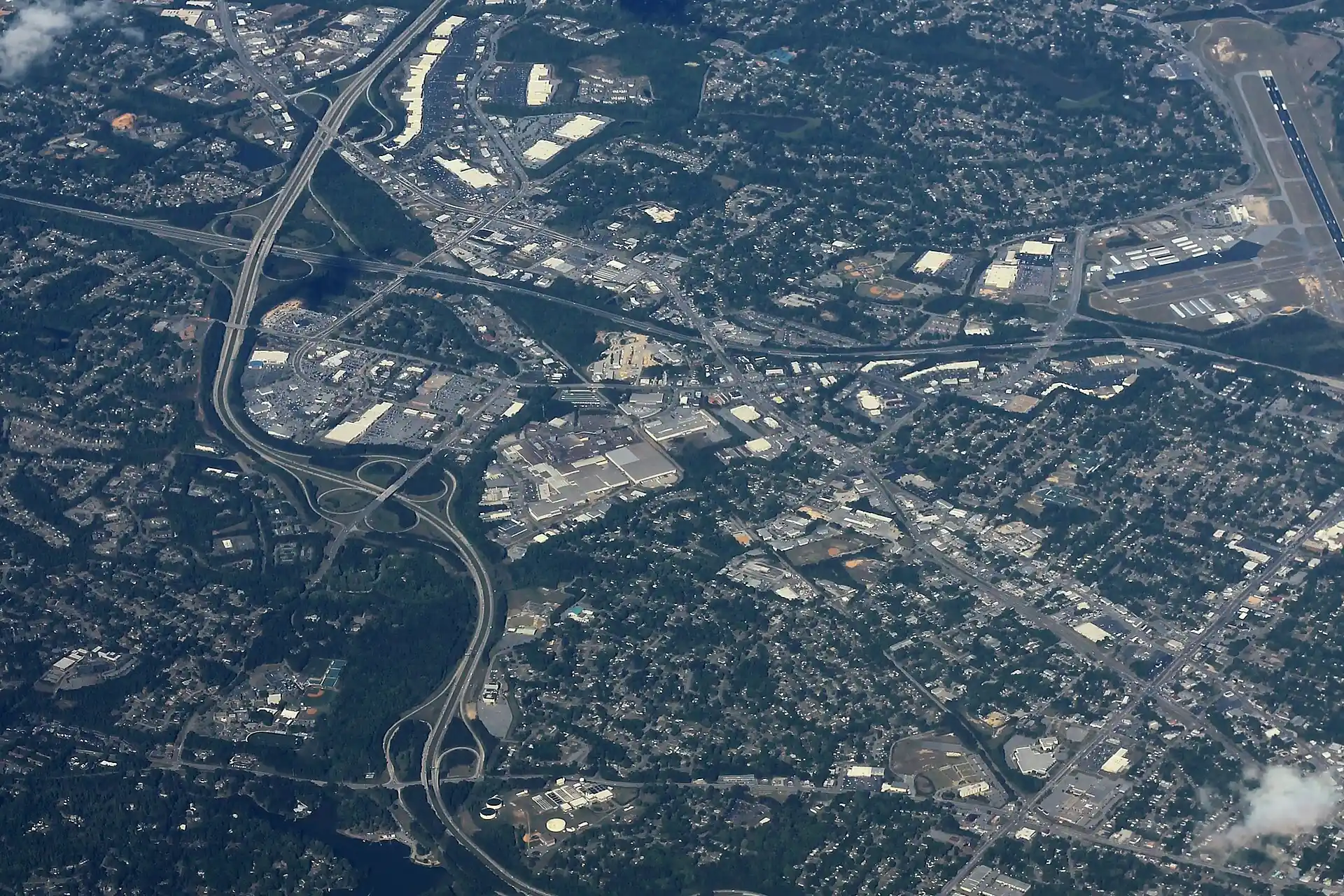 An aerial view of north Columbus along J.R. Allen Parkway and I-185, with the Columbus Airport runway at right.