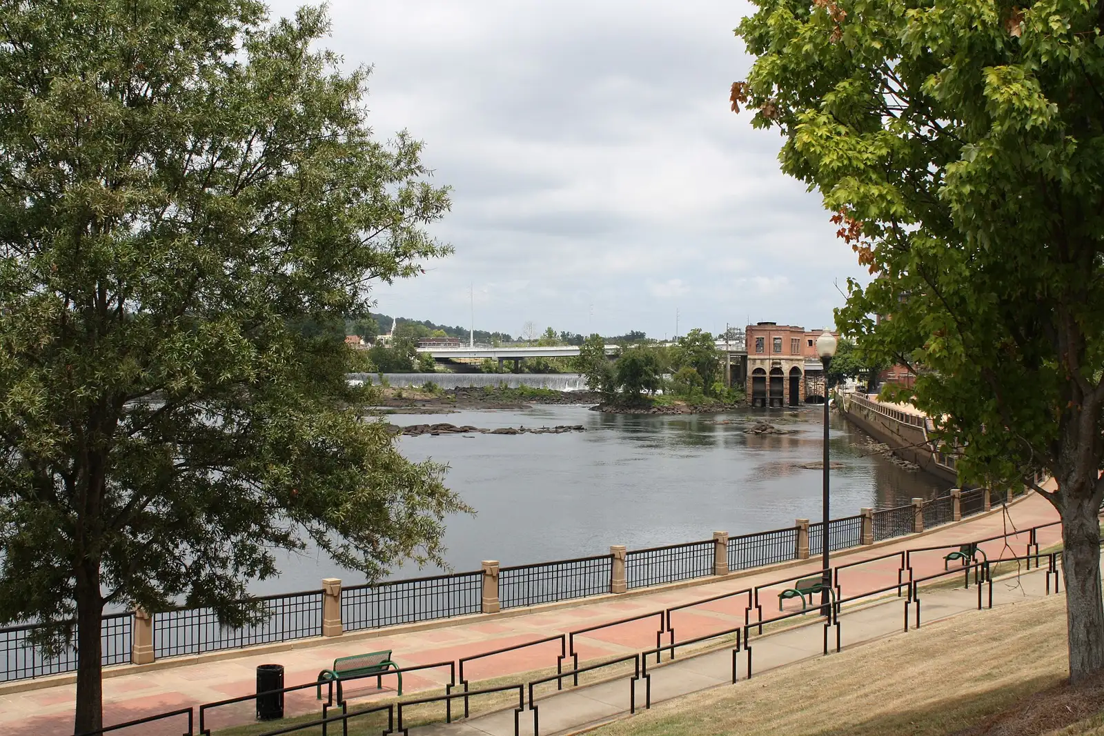 A dam and an old power house on the Chattahoochee River, seen from the RiverWalk in Columbus.