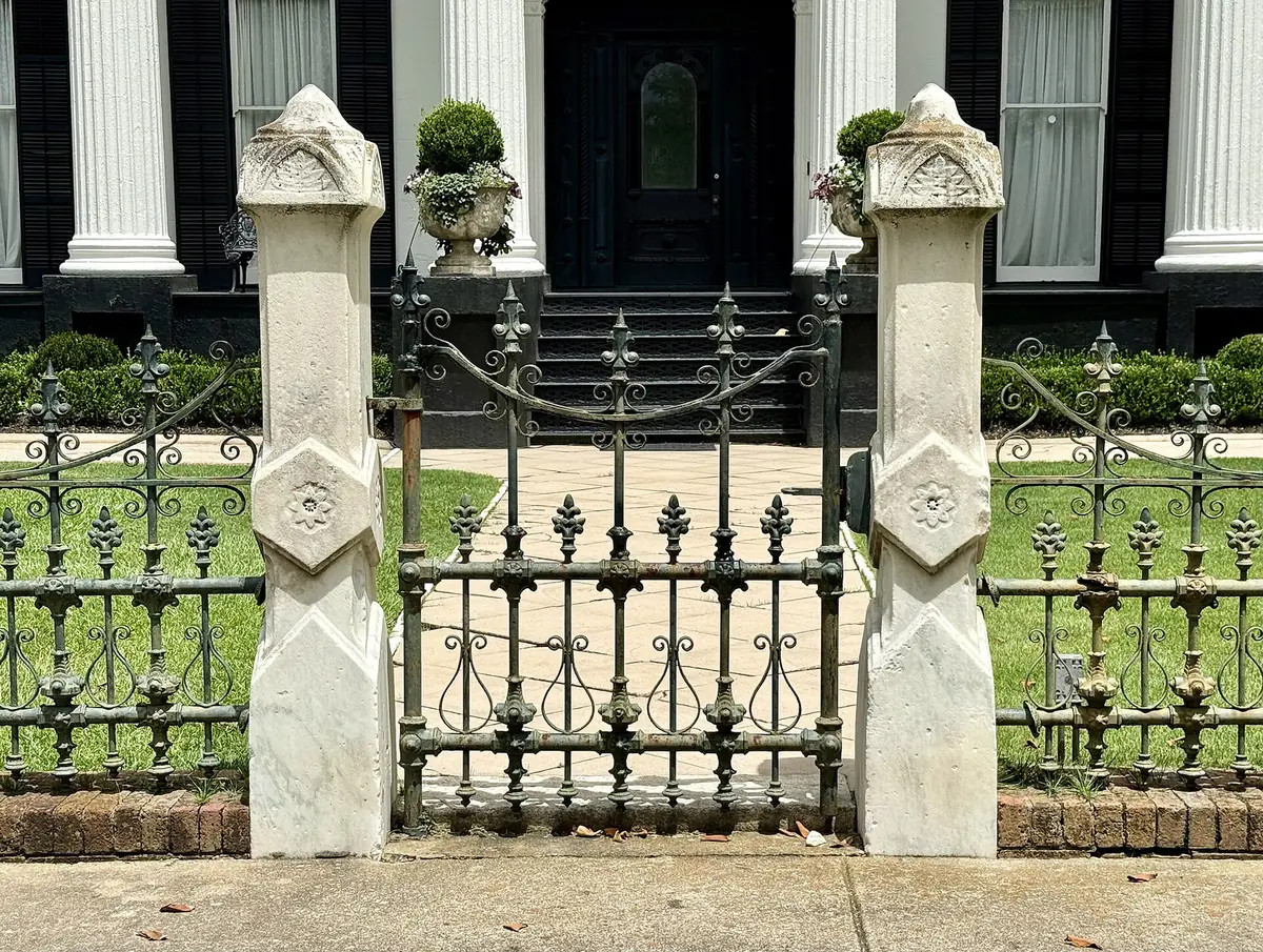 The iron gate of the Illges House in the High Uptown Historic District, near the school.