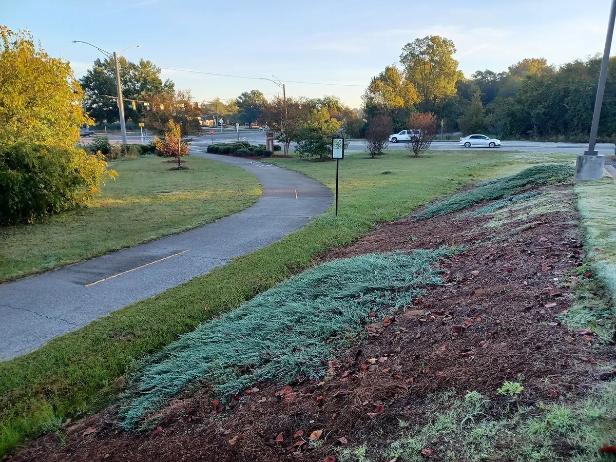The Fall Line Trace multiuse trail in Columbus, lined with planted beds.
