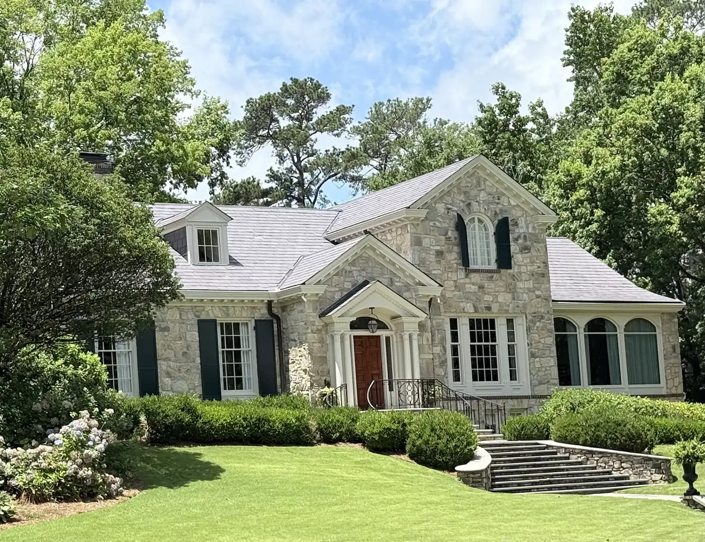 A stone house with a front stair in the Peacock Woods-Dimon Circle Historic District in Columbus.