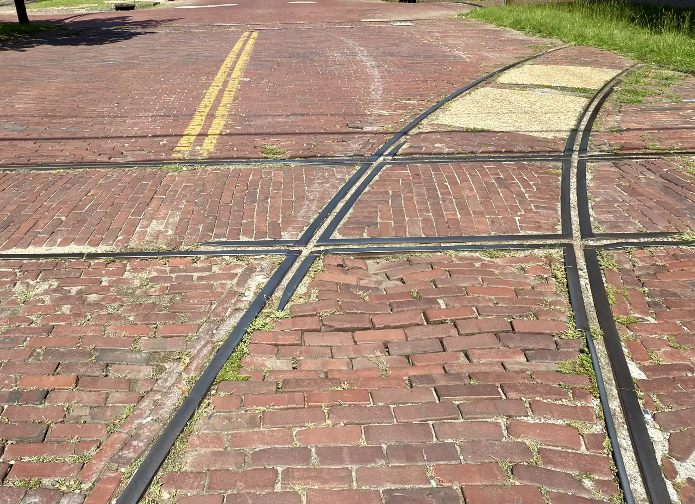 Brick paving and old streetcar tracks at Broadway and Eighth Street in Uptown Columbus.